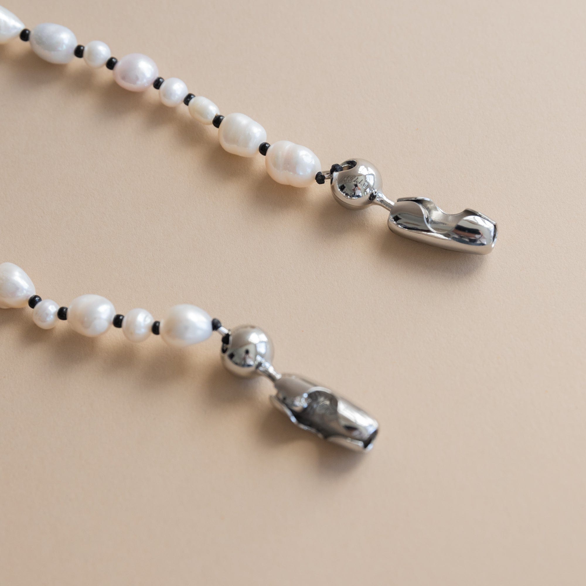 Ossa New York Tech Accessories Wristlet Phone Cord in Pearl with Black