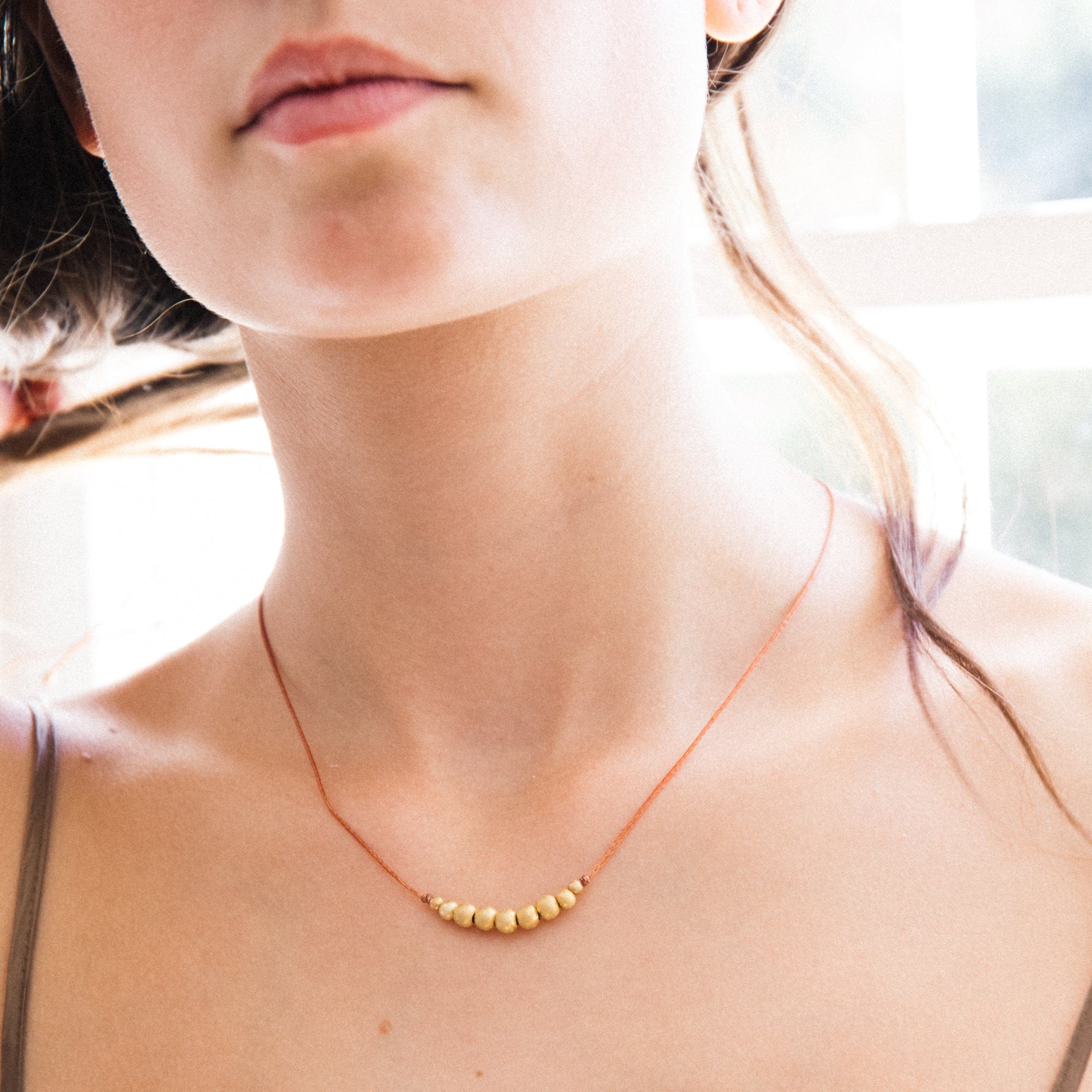 River Song Necklaces Gold Beaded Necklace on Taupe Thread