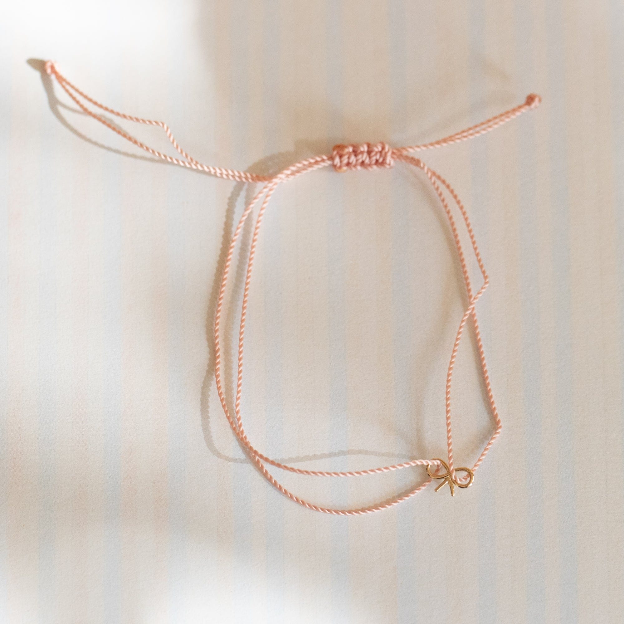 Hortense Jewelry Bracelets Baby Pink Itsy Bitsy Bow Cord Bracelet