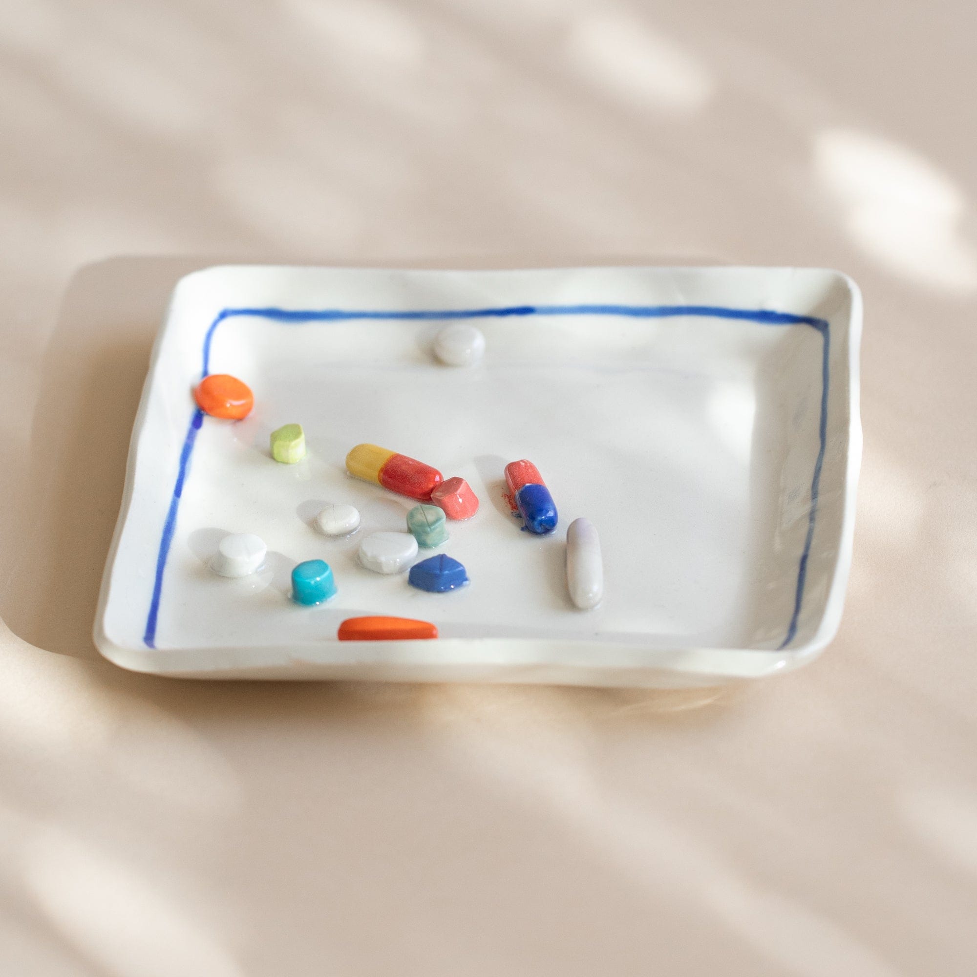 Pot Lady Objects Square with Blue Rim Ceramic Pill Plate