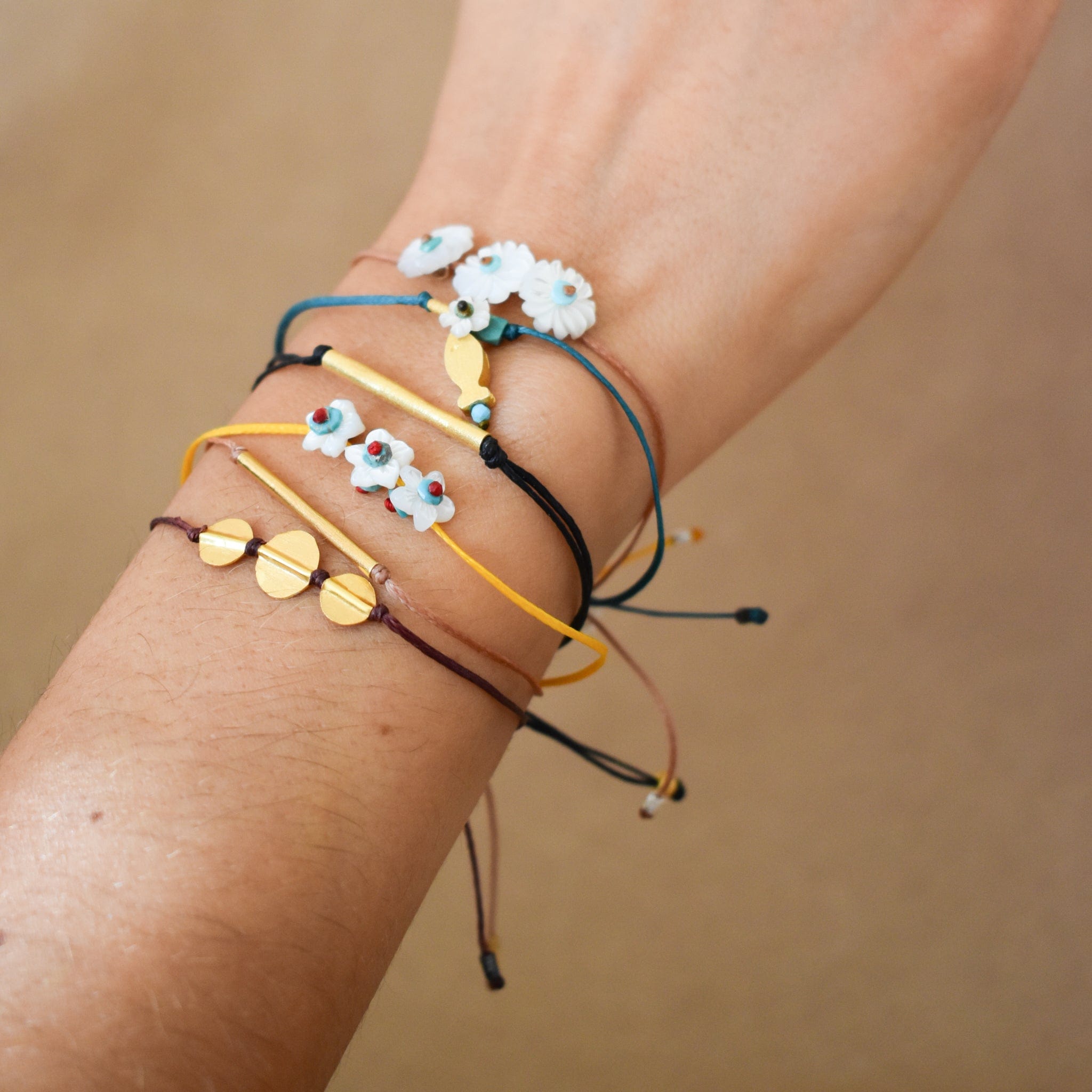 River Song Bracelets Tiny Treasures White Flowers Bracelet on Marigold Chord